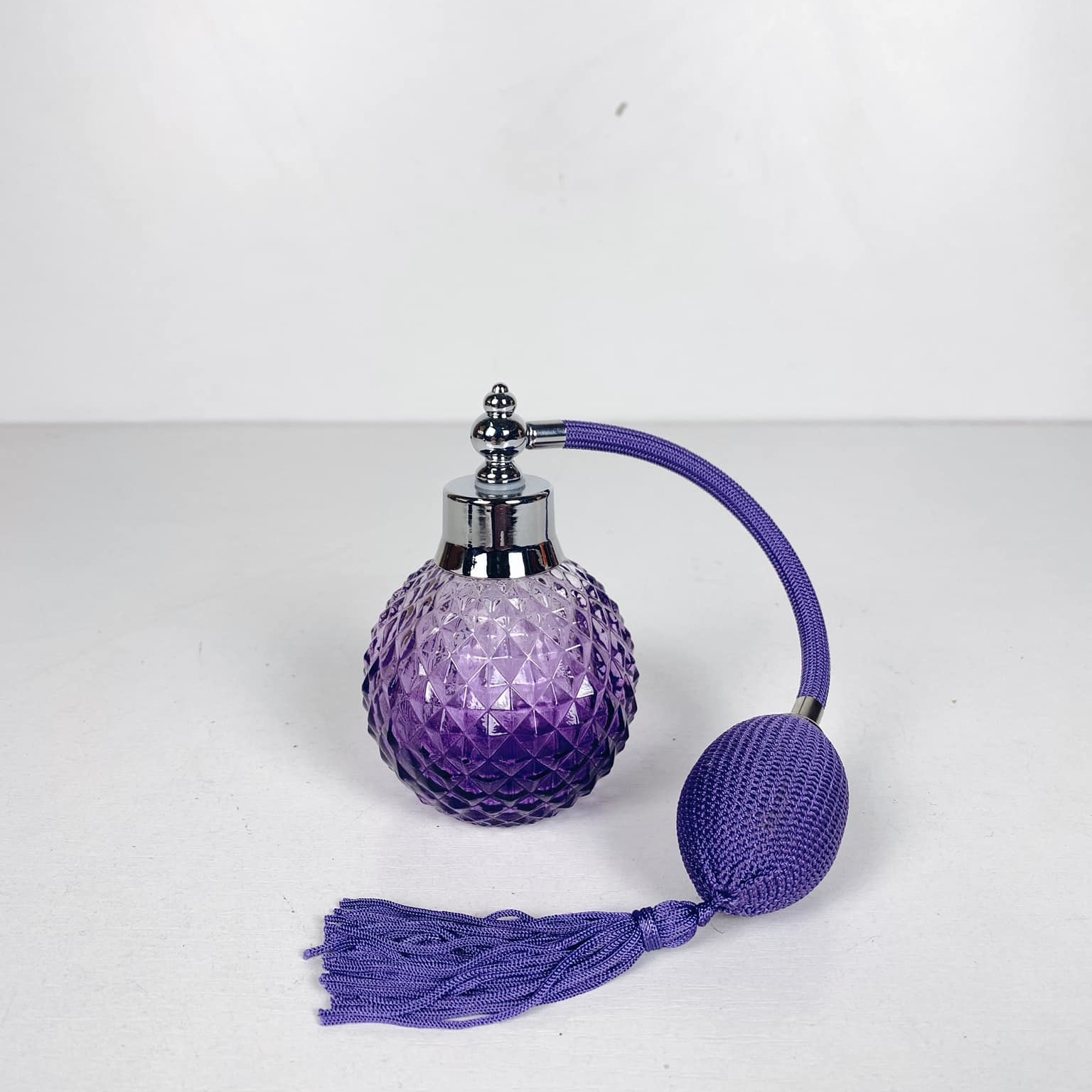 Флакон для парфумів з помпою рельєфне скло фіолет BR-003