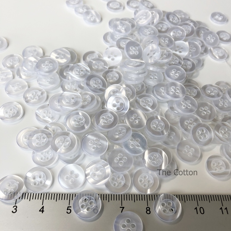 86.06.3.- Гудзики круглі, 11 мм - Напівпрозорий - (10/100 шт.)