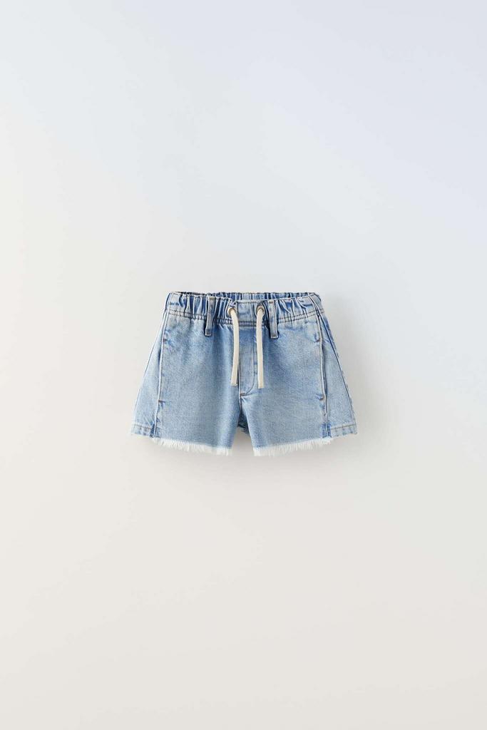 Потерті джинсові шорти-бермуди