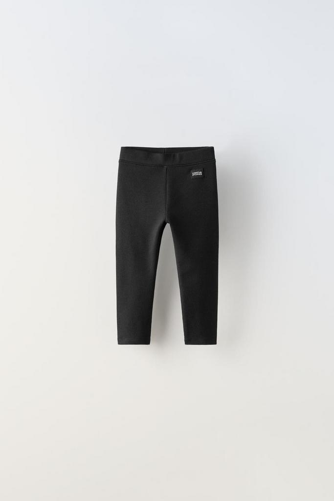 Легінси в рубчик із лейблом