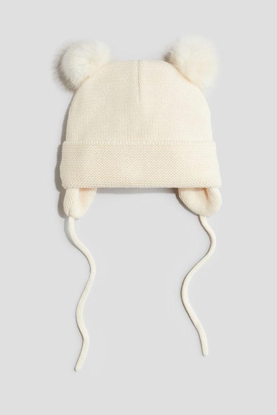 Утеплена в'язана шапка