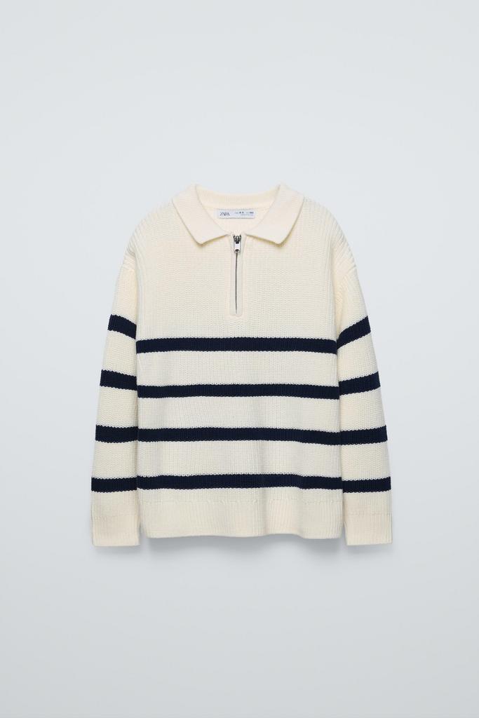Смугастий светр із блискавкою