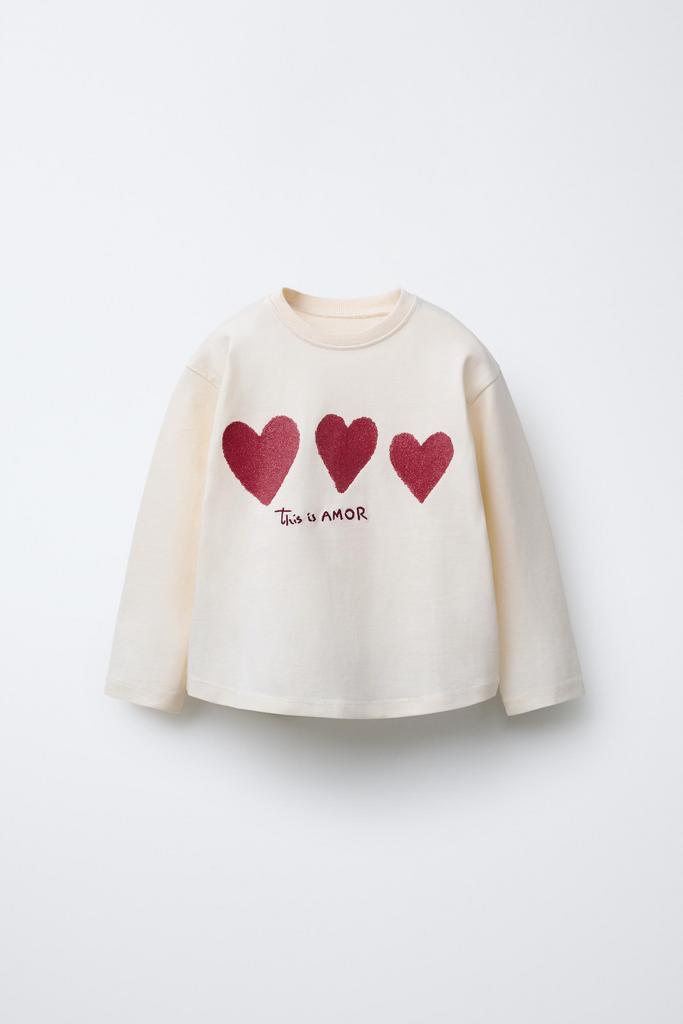 Лонгслів з принтом та блискучими  ефектом