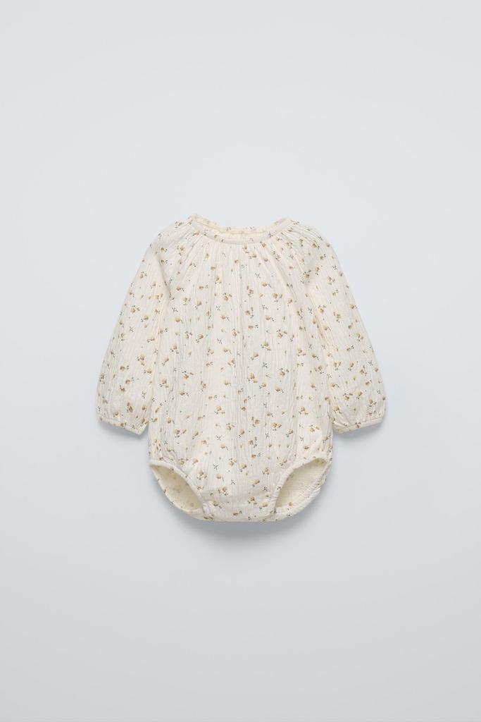 Текстуроване боді з квітами