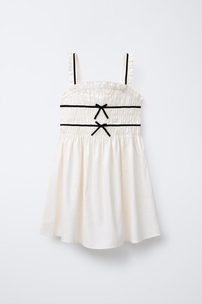 Cукня з контрасною обробкою та бантами