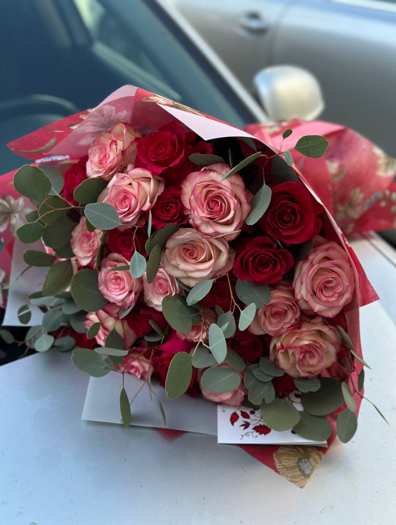 Mono bouquet red and pink roses with eucalyptus
