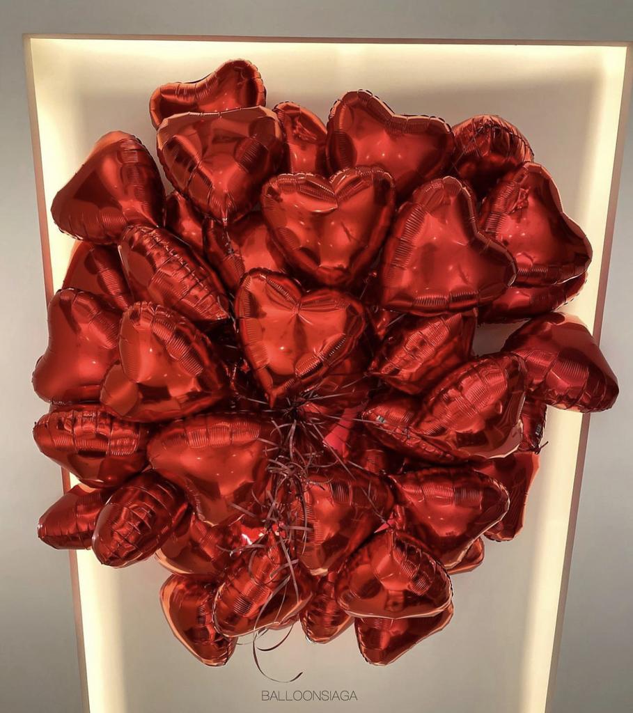 Bunch of red heart shaped balloons