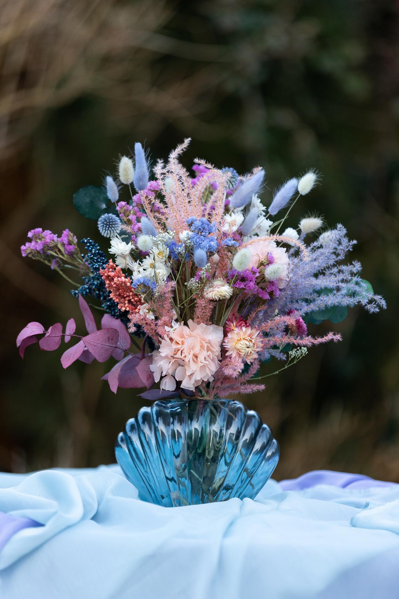 "Blue Shell" arrangement in glass vase