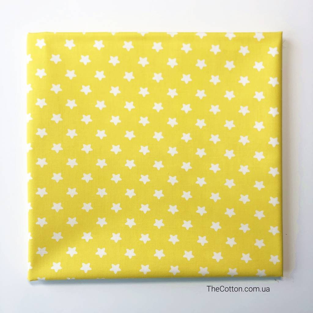 14.152.4. Відрізи бавовни - Сатин - Зірочки 11 мм, білі на жовтому