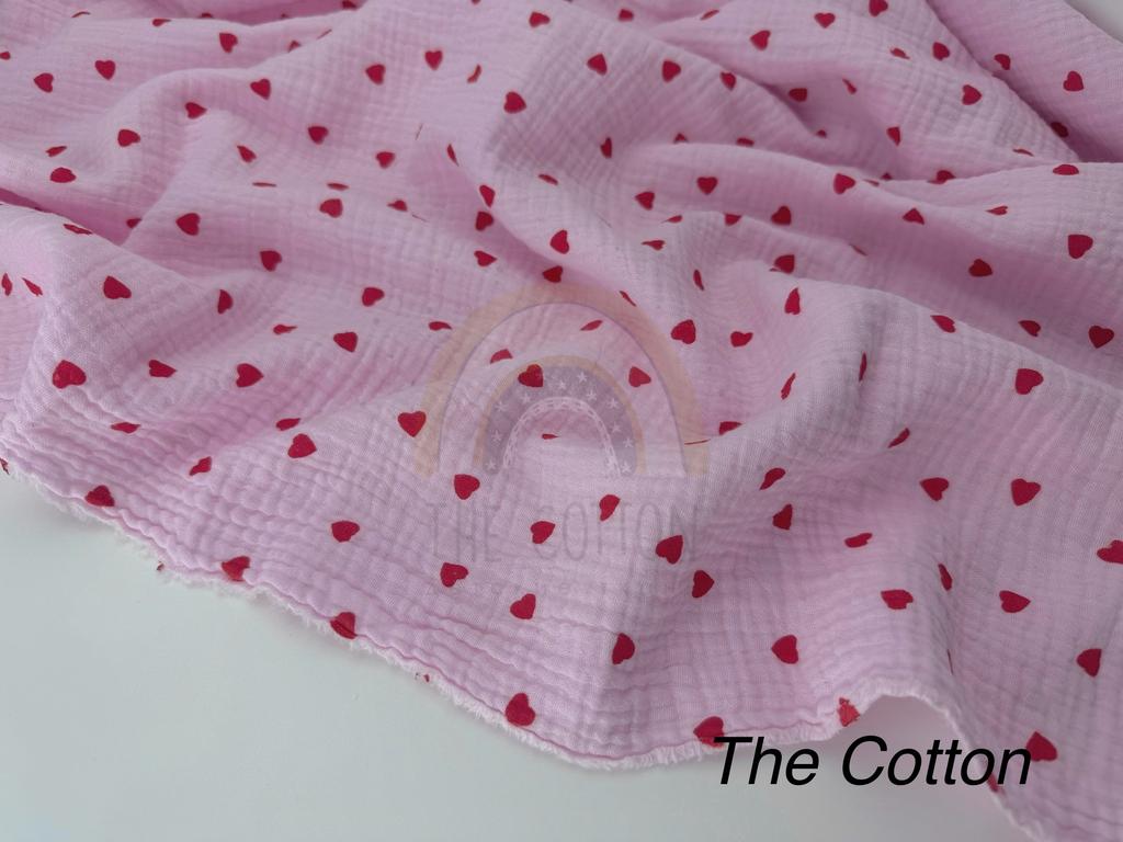 Муслін - Сердця червоні дрібні  на рожевому