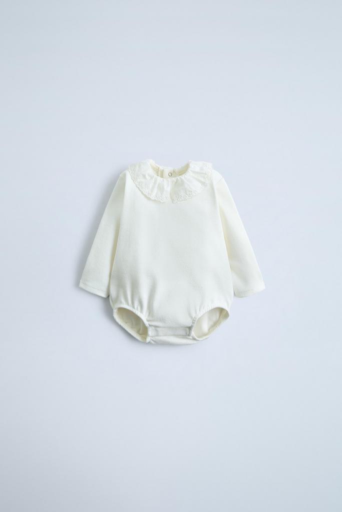 Плюшеве боді з контрасним виложистим коміром