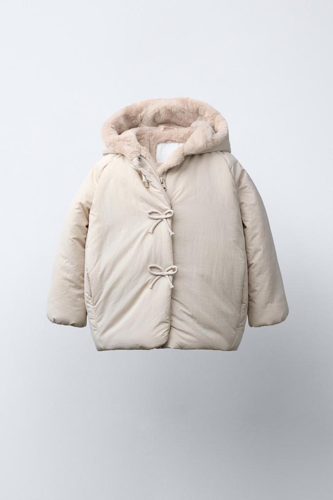 Стьобане пальто WATER REPELLENT з бантами