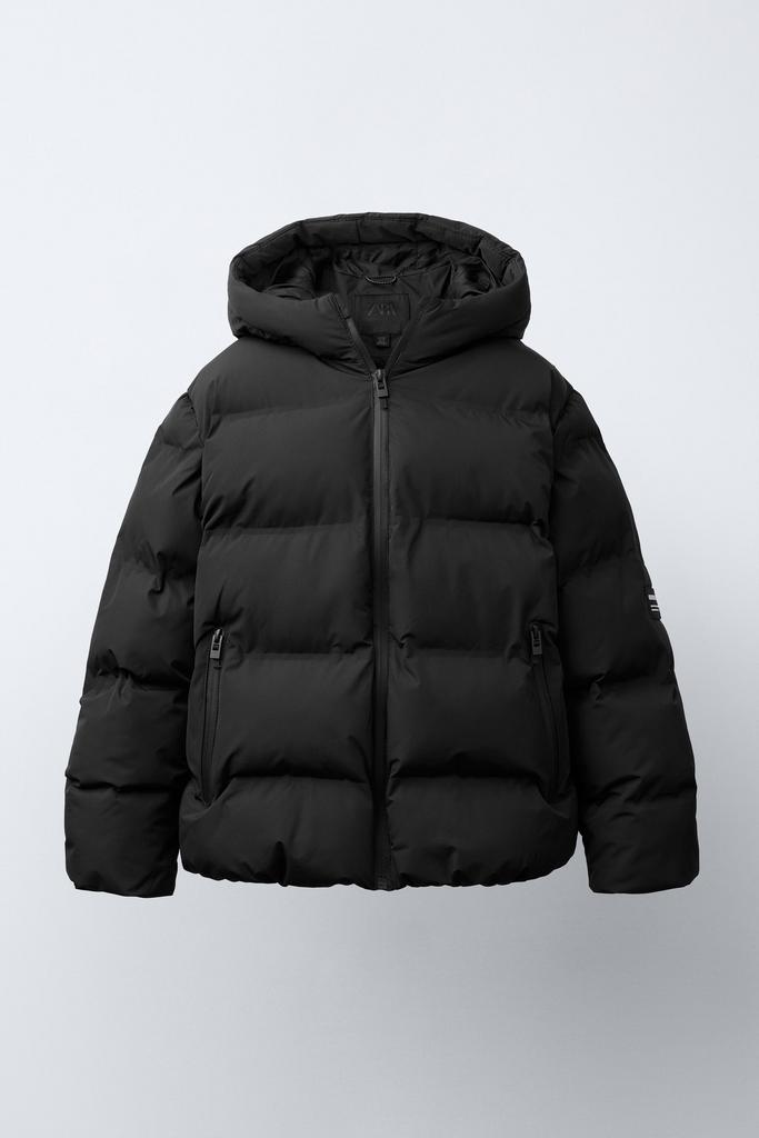 Стьобана куртка WATER-REPELLENT з нашивкою Чорна